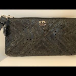 Coach Black Leather Clutch with Laser Cuts.